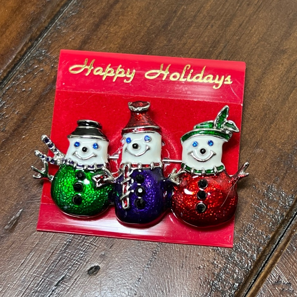 Three silver snowmen pin, from the Artisan shop